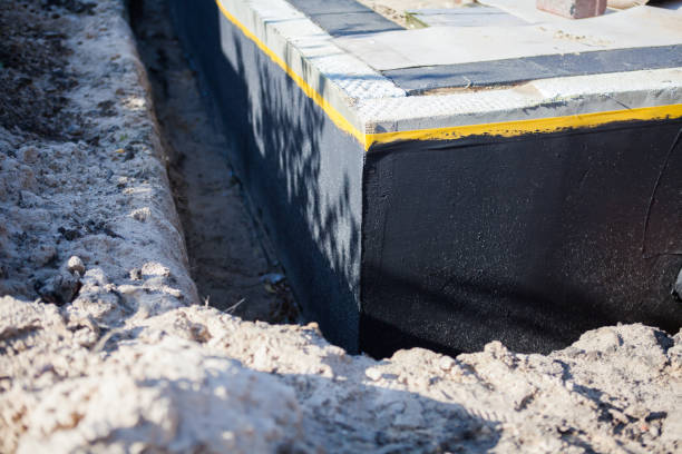 Professional Waterproofing technician working in Royal Center, IN